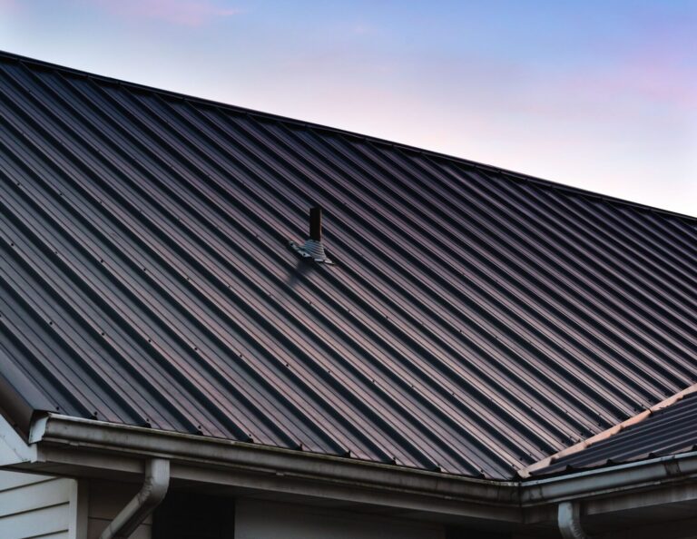a beautiful house metal roof during the sunset